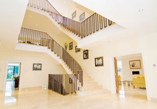 Illustration for article titled Footballer’s Snazzy House — Can You Guess The Owner?